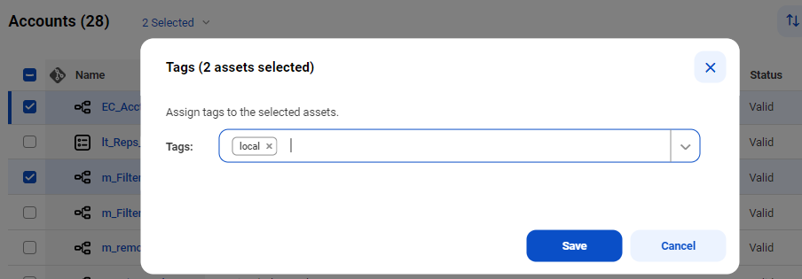 The Tags dialog box shows two assets selected and includes the Tags drop-down list. 
						  